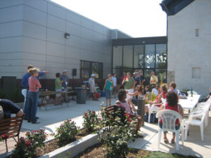 celebration outside of museum space with tables and chairs