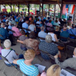 Audience attending an outdoor mass.