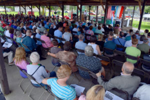 Audience attending an outdoor mass.